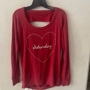 Women’s long sleeve super soft sweatshirt with open back detail.